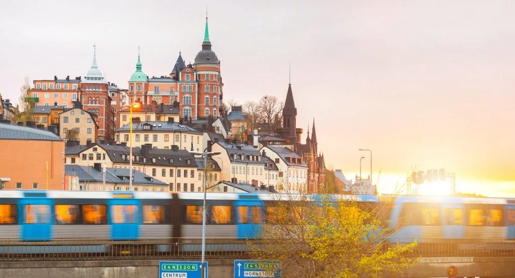 Stockholm, view of buildings and train at dusk
